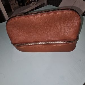 Maurice’s brown makeup bag